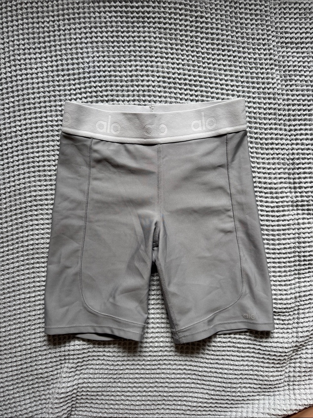 Alo Yoga high waisted bike shorts in light grey in size S